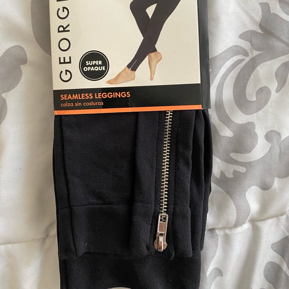 Black seamless leggings with silver zipper on bottom leg